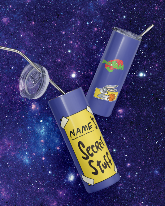 Two purple insulated tumblers with metal straws on a starry galaxy background. One tumbler has a yellow tape graphic reading 'NAME: Secret Stuff,' and the other has a cartoon rabbit graphic with a green and red logo above it.