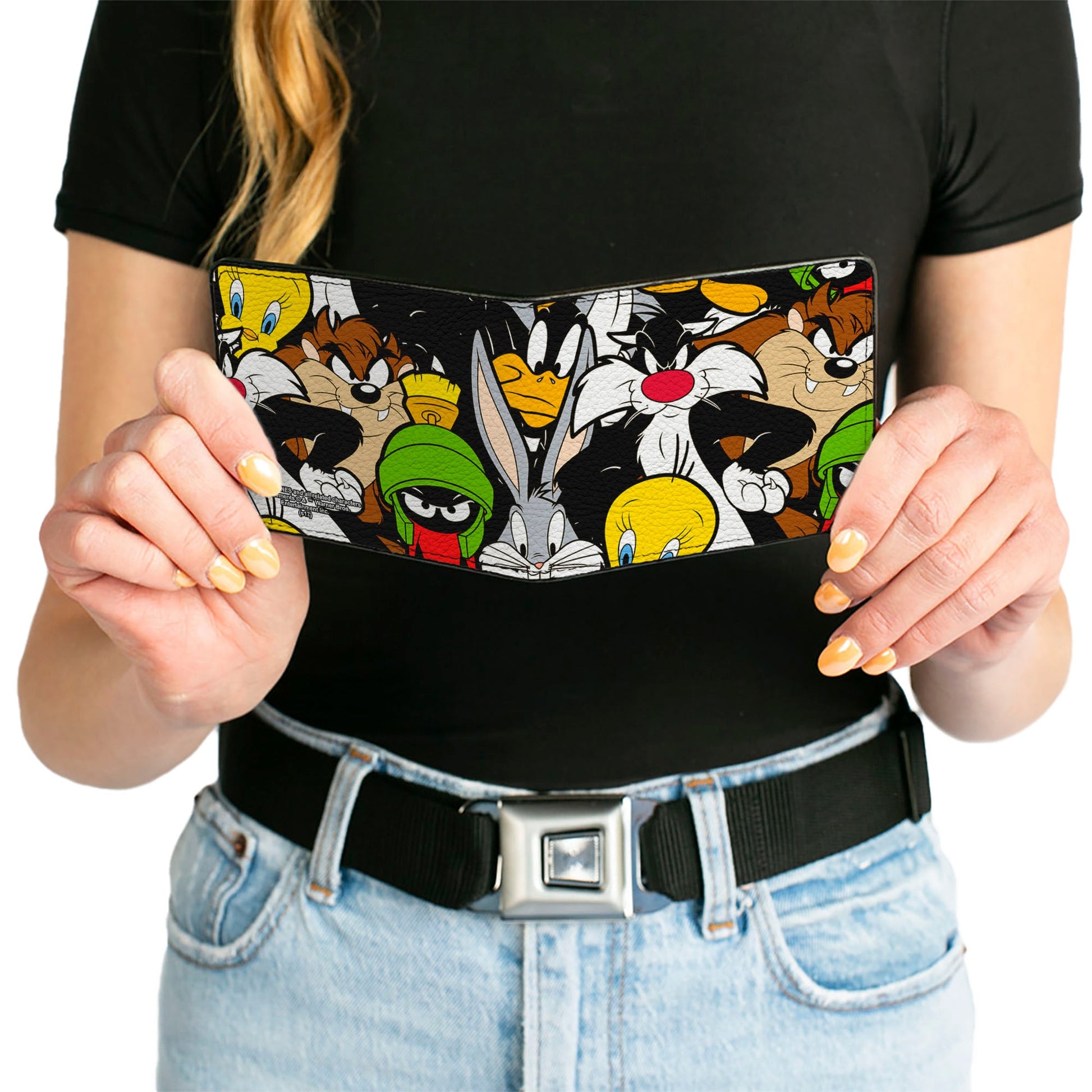Wallet held in hand to show size and slim profile.
