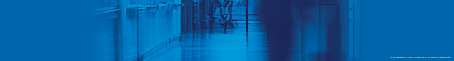 Blue-tinted hallway with people walking, blurred effect for The Pitt collection banner.